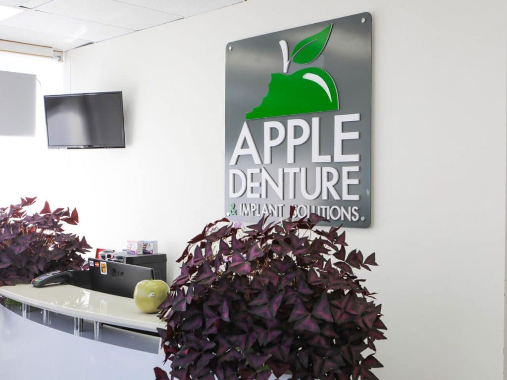 apple denture clinic