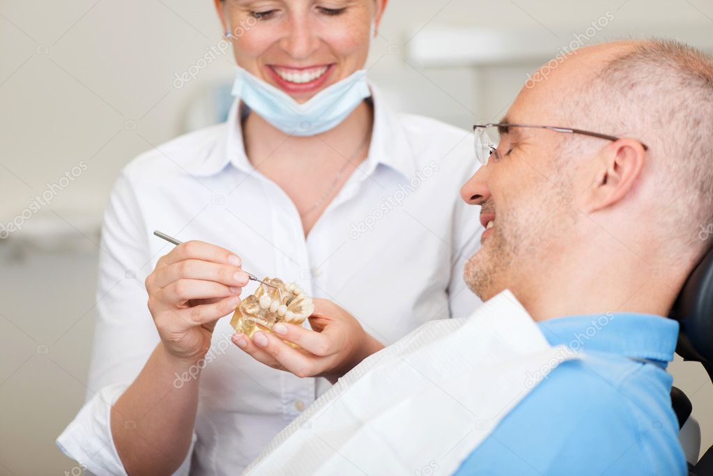 a female dentist explaining dentures to her client