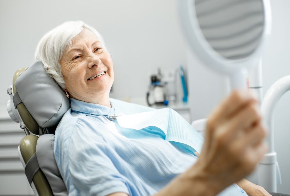 Elderly woman enjoying her dentures